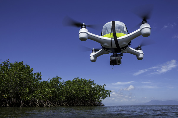 http://blog.nature.org/science/2014/08/11/innovation-drone-mapping-of-coral-reefs-and-the-coastal-zone/jordan-mitchell-pilots-a-quad-copter-drone-over-a-red-mangrove-forest-the-drone-carries-a-gopro-3-camera-used-to-survey-the-bottom-topography-mitchjetgmail-com/